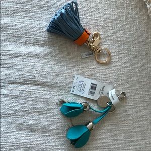 Handbag accessories.  1 Coach and 1 Nine West